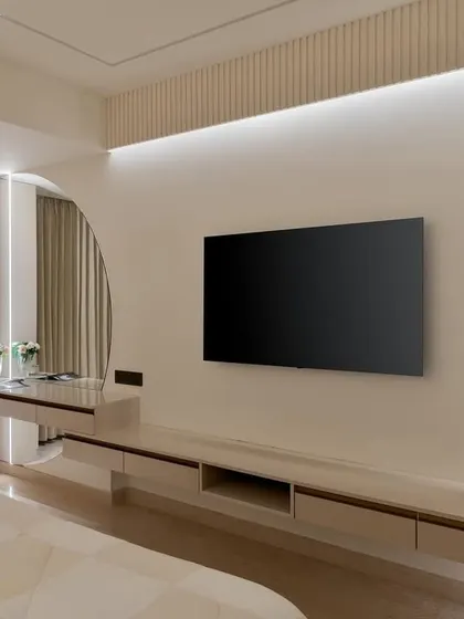 The final master bedroom TV wall, perfectly executed to match our design, creating a serene and clutter-free environment.