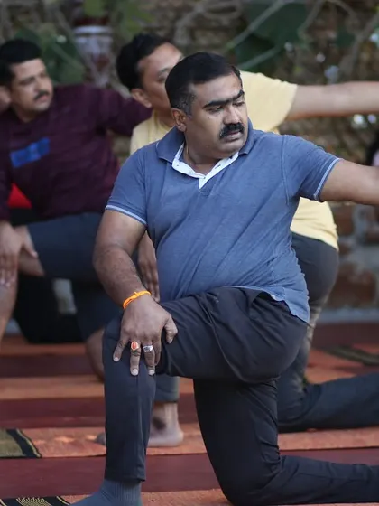 Guiding a diverse group of individuals in their yoga practice.