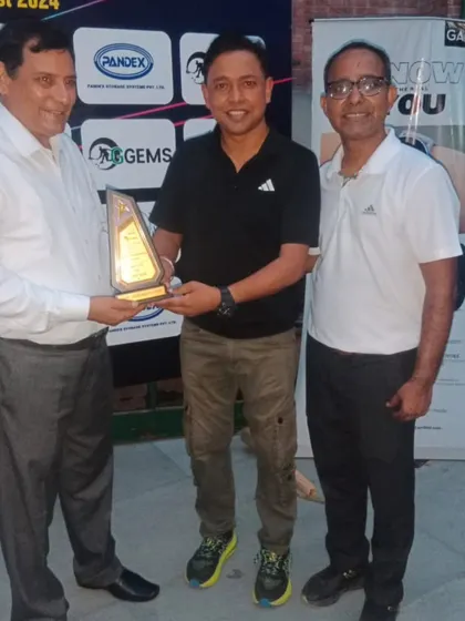 Receiving a token of appreciation at the inter-school tournament. It is an honor to contribute to the school sports ecosystem.