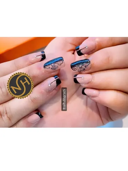 A sophisticated and artistic French manicure. This design features a short, square shape with black tips, delicate butterfly line art, and a single rhinestone accent.