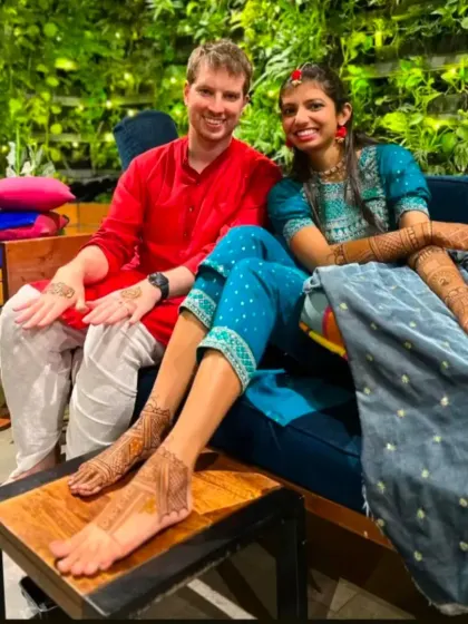 It's wonderful to be a part of multicultural weddings. Here, a happy couple displays their complementary mehandi and foot henna.