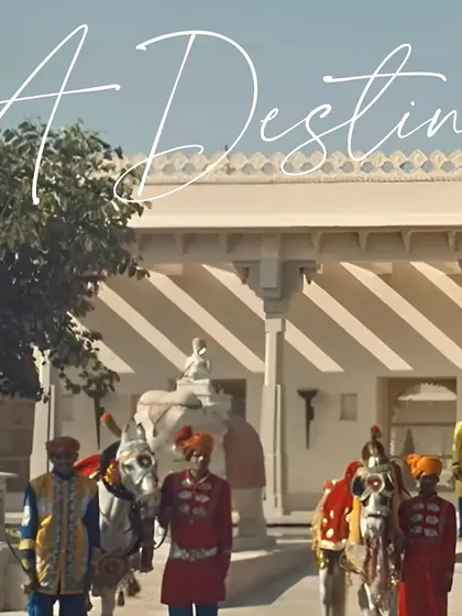 The arrival at a palace wedding should feel like a royal procession. Here, decorated horses and attendants in colorful Rajasthani attire await the guests, setting the stage for the magnificent moments to come.