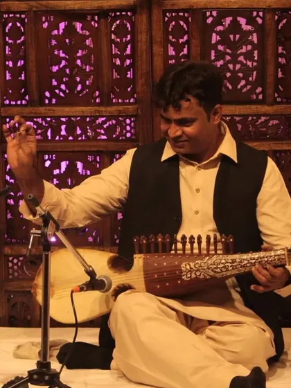 A close-up of Sh. Imran Khan ji, showcasing his mastery over the Sarod, an instrument known for its deep and resonant sound.