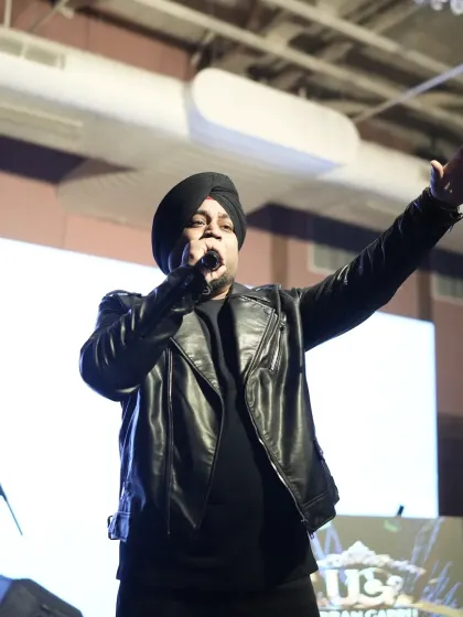 A close up of the lead singer during the Sangeet night performance.