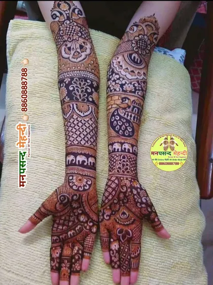 An intricate full-arm design with a variety of traditional motifs, including elephants and peacocks. The dense patterns are perfect for a bride who wants a heavy, classic look.