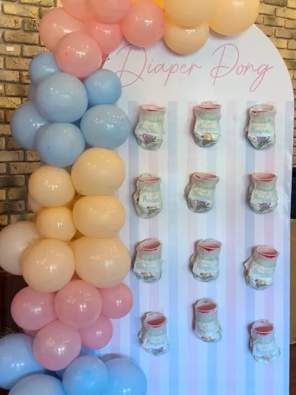 "Diaper Pong" is another fun game idea that we can create a custom board for, matching the theme and colors of your event.