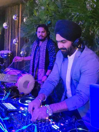 In the zone with my percussionist, mixing beats while he lays down the rhythm. This synergy is what makes our live fusion sets so powerful.
