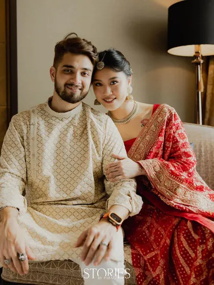 A relaxed and intimate portrait of Nick and Carrie seated together. This image captures their comfortable and warm connection, making them feel both aspirational and relatable.