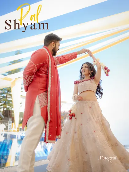 A playful dance during the Haldi celebrations. The groom twirls his bride, both of them smiling, in a candid moment of fun.