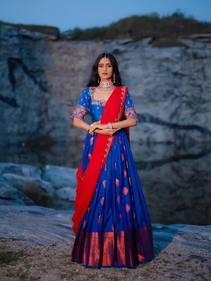 Another angle of the royal blue half saree, highlighting the rich colors and the beautiful fall of the fabric.