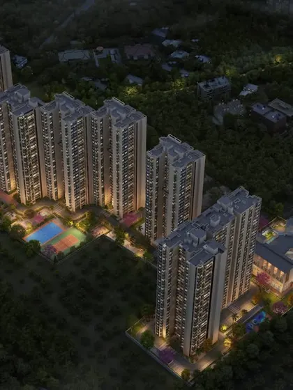 A night-time aerial view of Sattva Lumina, illustrating how landscape and architectural lighting work together to create a safe, beautiful, and vibrant community after dark.
