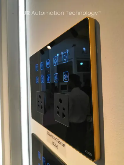 A side view of a Xeon smart panel with a reflective black surface and gold aluminum frame, as seen at our IDAC Expo stall. This highlights the premium materials and slim profile of our products.