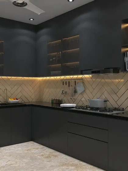 A full view of the moody black kitchen concept. The layout is a practical L-shape, with a herringbone backsplash adding texture and visual interest.