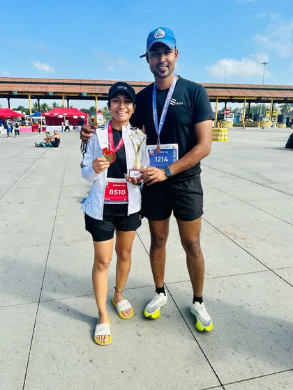 Posing with my husband after the Ajmera Thump Run. His support is my rock, and sharing these victories with him is the best part.