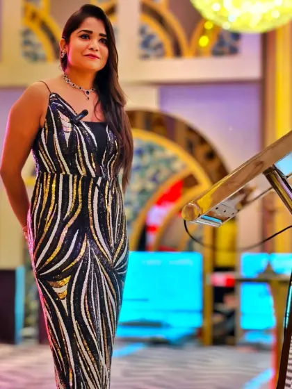 A full-length view of my elegant look for the RP Group's gala evening. I transition seamlessly from the formal business meet to the celebratory dinner.