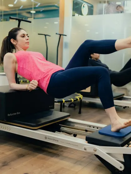 This tabletop position with a leg extension on the Reformer box is a great exercise for targeting the glutes and hamstrings while maintaining core stability.