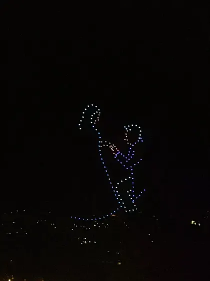 A drone formation depicts a groom proposing to his bride. This timeless, romantic image is one of the many ways we can immortalize your holy union in the sky.