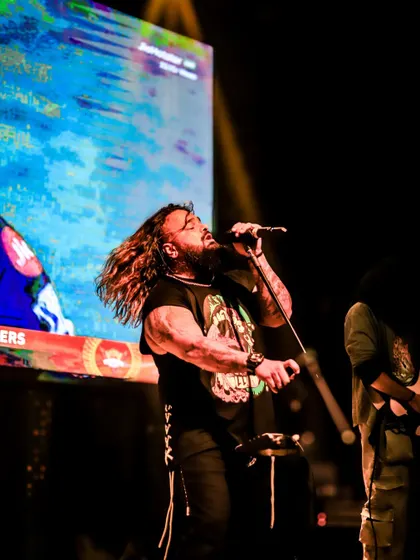 Lost in the music, our vocalist delivers a powerful performance. We pour every bit of our passion into every song.