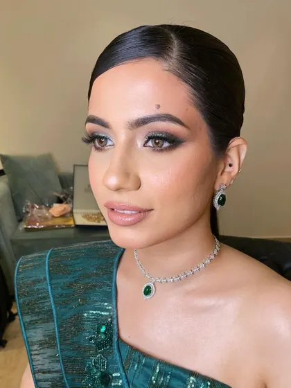 A close-up of this stunning green smokey eye. Notice the skin texture, it's beautiful and real. My goal is never to hide your skin, but to make it look its absolute best.