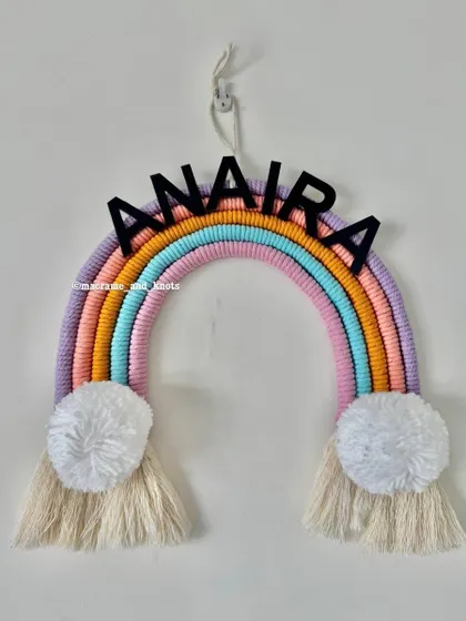 A simple and sweet rainbow name hanging for Anaira, with the name placed right on the pastel rainbow.