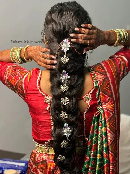 A full view of the diamond-studded bridal braid. This is a modern and glamorous take on the traditional wedding braid, perfect for the bride who wants to sparkle.