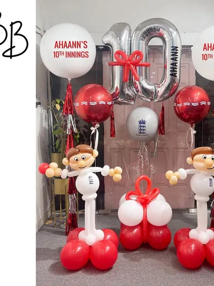 Howzat! A perfect setup for a young cricket fan's 10th innings. This arrangement includes two cricketer sculptures, a personalized "10th Innings" message, and cricket ball details for a sporty celebration.