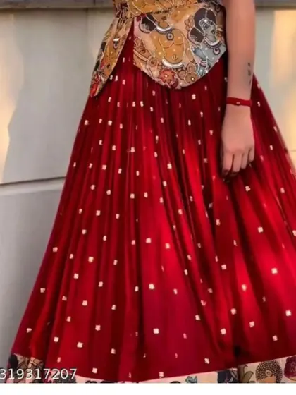 A closer look at the flared red georgette skirt from the Kalamkari print set. You can see the delicate sequin work and the printed border that complements the unique blouse.