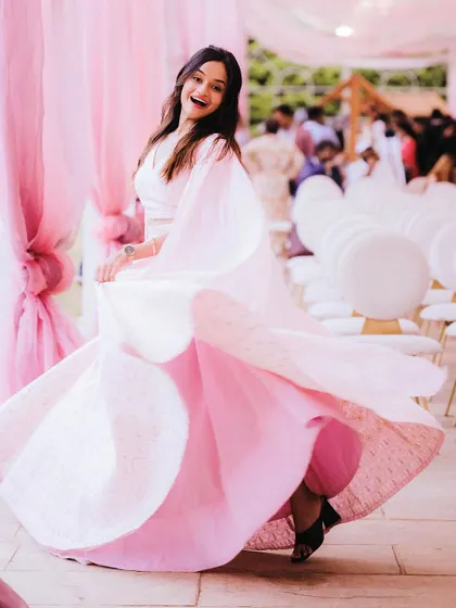 I'm a Barbie girl in a Barbie world. Twirling in this gorgeous pink outfit before hosting an event, feeling chic and energetic.