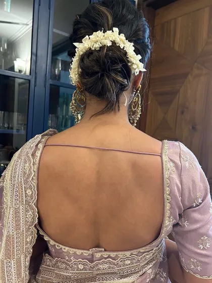 A view from the back of the classic gajra bun, showing the neatness of the work and how beautifully it complements a traditional saree or lehenga.