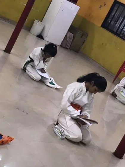 Progress in karate is not just physical. Our students are taking their theory exam, a written test that covers history, etiquette, and technique. This ensures a complete understanding of the art form.