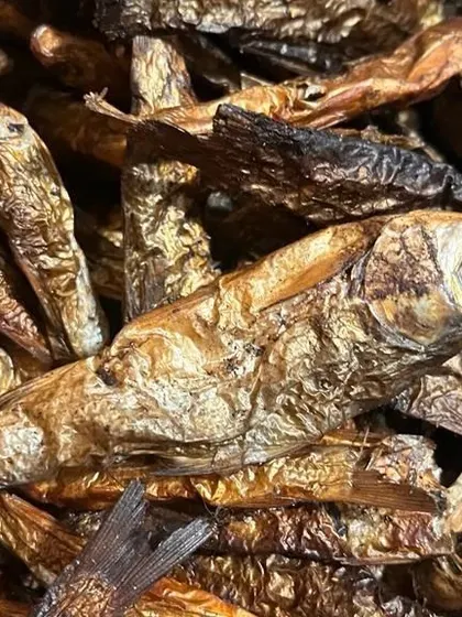 A close-up of the whole smoked fish I offer. You can see the golden, papery skin and firm texture, which is a sign of proper smoking.
