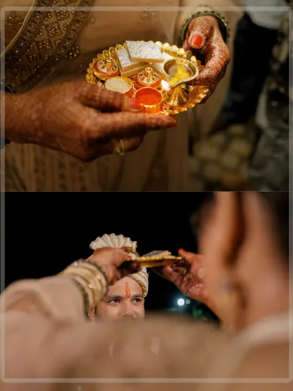 A close-up of the Aarti thali and the moment of the groom's welcome ceremony, focusing on the traditional details.