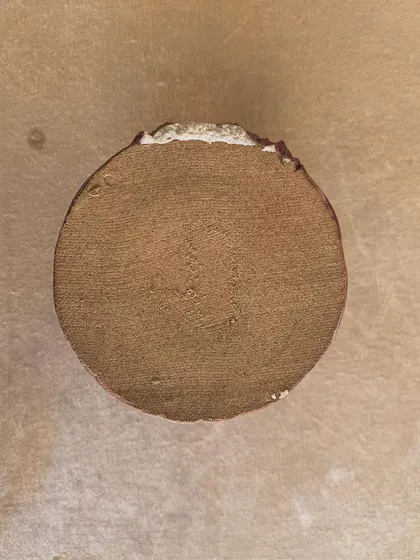 The bottom of a hand-built piece, showing the raw, unglazed clay. I love leaving this part exposed as a reminder of where the piece came from.