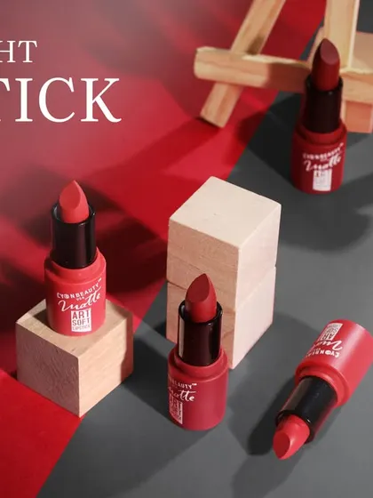 A collection of lipsticks arranged with miniature art easels, creatively positioning the product as a work of art.