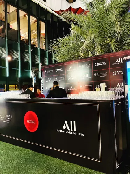 A sleek, branded bar for a Travel + Leisure event at Pullman. We can customize service areas like bars with corporate logos and branding to ensure a professional and cohesive look.