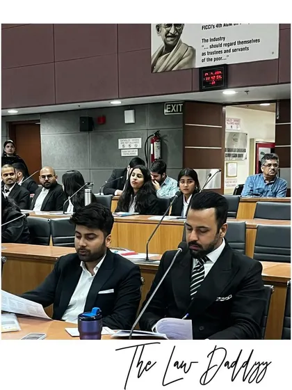 Reviewing materials with my colleague during the World IP Day conference. Continuous learning and active participation in legal discourse are key to my practice.