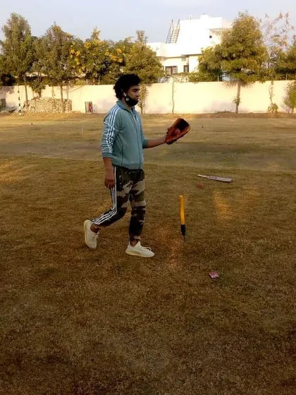 Coach Mithun Manhas during a break in a fielding session. His presence provides inspiration and a clear example of the professionalism required to play at a high level.