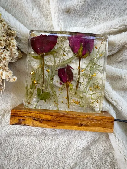 A client's special bouquet roses transformed into a glowing memory. This resin block lamp seals the flowers forever, creating a piece that shines with love.