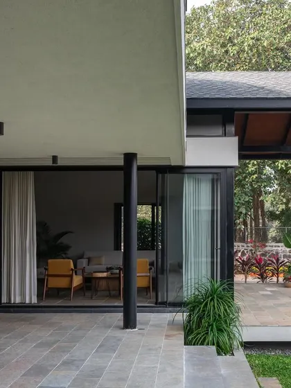 The patio at Grove House, a seamless extension of the indoor living space, perfect for enjoying the tropical climate.