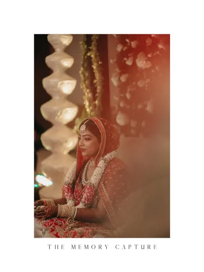 A quiet, contemplative moment of the bride during her wedding ceremony. The soft, diffused lighting and her serene expression create a beautiful, candid shot.