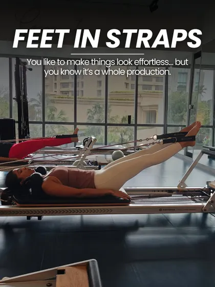 "Feet in Straps" looks effortless, but it's a whole production. This series is amazing for hamstring flexibility, hip mobility, and core engagement.