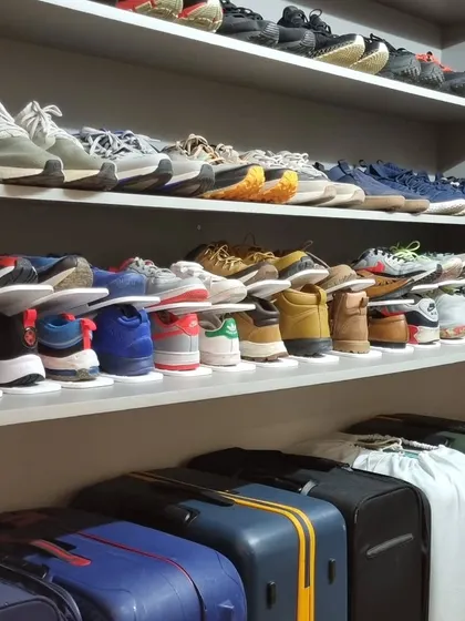 The same shoe closet, but this time using shoe slots to double the storage capacity. This is a great trick for anyone with a large shoe collection.