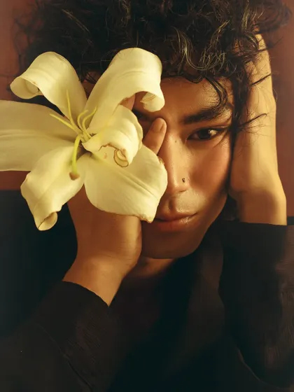 A gentle and intimate close-up, showcasing a softer, more romantic character for a male model's portfolio.
