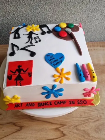 A special cake to celebrate the end of our Art and Dance summer camp. It even has little art-themed decorations on it.