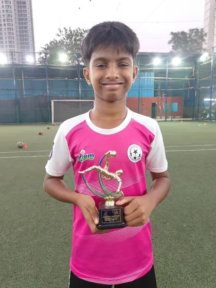 Celebrating our individual award winners. Deon Shetty holds his trophy for Best Goalkeeper, a testament to his hard work and talent.
