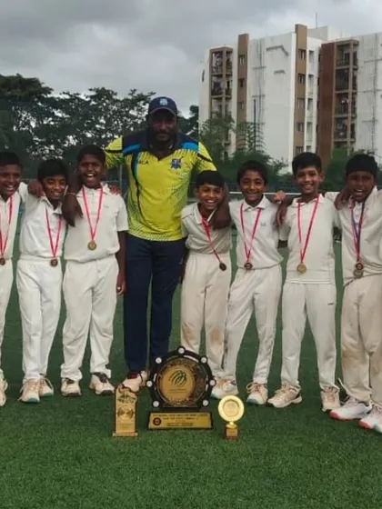 The U-10 team with their coach, medals, and the championship shield after a phenomenal victory in the Eventistic Ventures Tournament.
