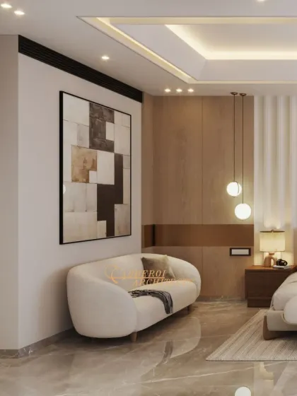 A curved sofa and abstract art add a touch of modern elegance to this spacious bedroom, providing a stylish corner for lounging.