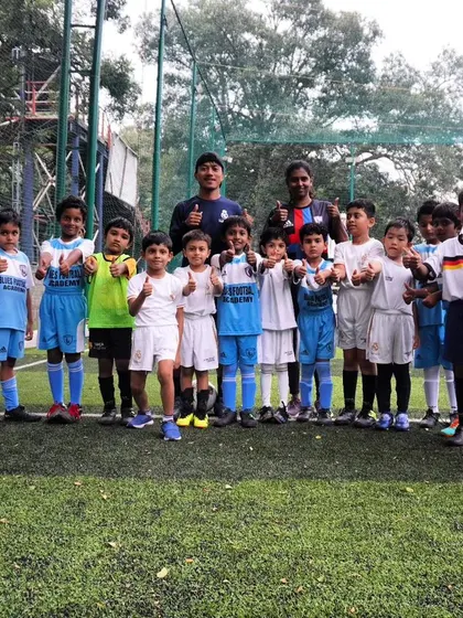 Our young team gives a thumbs-up, showing their positive attitude and enjoyment of the game.