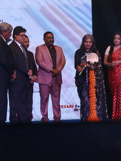 Our director is felicitated on stage for her leadership and guidance in organizing the successful event.