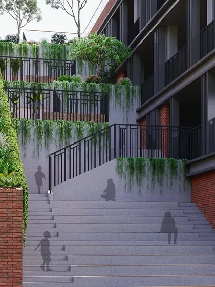 A close-up of the stepped green terraces at the Chhattisgarh school. This biophilic design element serves as both an informal learning space and a way to naturally cool the building.